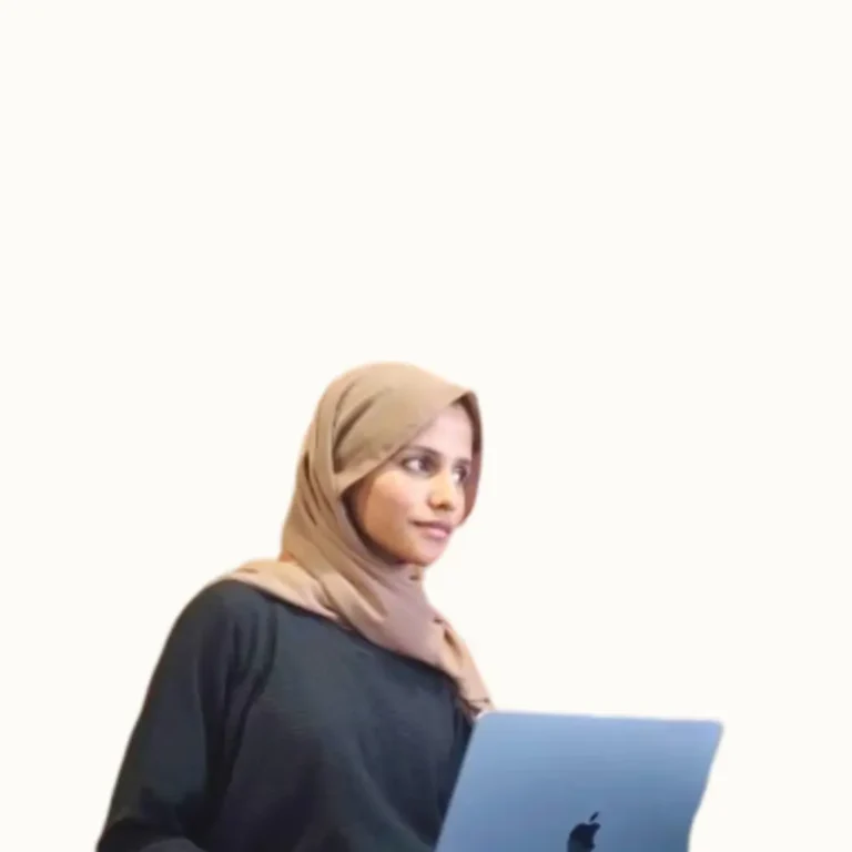 Freelance digital marketing strategist in Bahrain working on an Apple laptop.